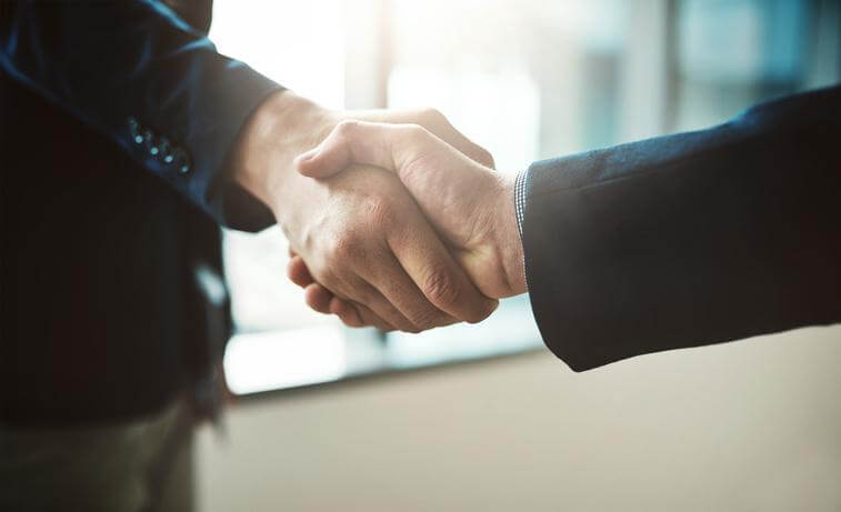 Image: Successful completion. A handshake to seal the deal.